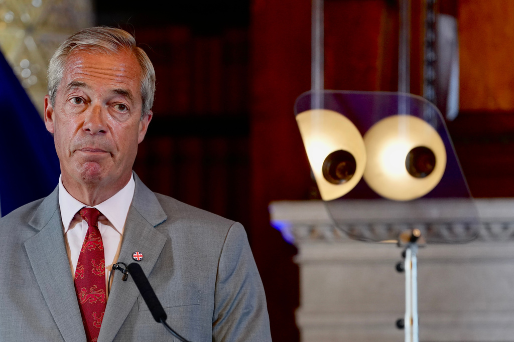 Nigel Farage, Leader of Britain's Reform UK party, speaks during a press conference in London, Monday, Aug. 10, 2026. (AP Photo/Kin Cheung)