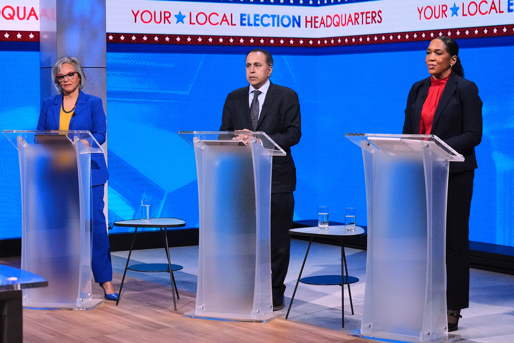 FILE - Candidates for the U.S. Senate, U.S. Rep. Robin Kelly, D-Ill., left, U.S. Rep. Raja Krishnamoorthi, D-Ill., center, and Democratic Illinois Lt. Gov. Juliana Stratton participate in a Democratic primary debate in Chicago, Feb. 19, 2026. (AP Photo/Nam Y. Huh, File)