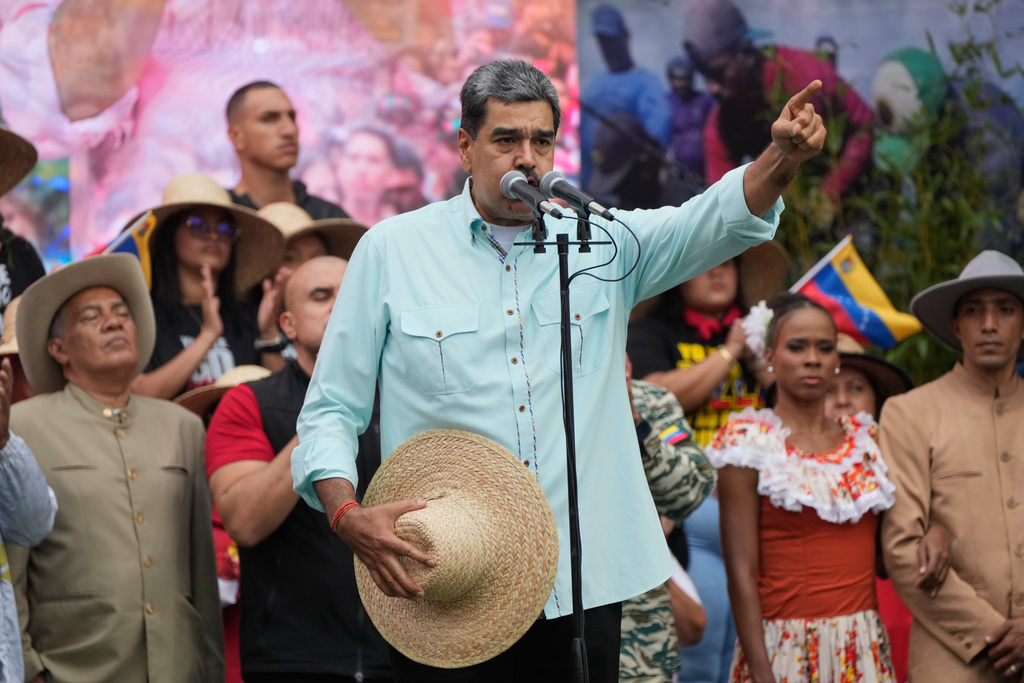 Nicolas Maduro speaks at a rally marking the anniversary of the Battle of Santa Ines, which took place during Venezuela's 19th-century Federal War, in Caracas, Venezuela, Wednesday, Dec. 10, 2025. (AP Photo/Ariana Cubillos)