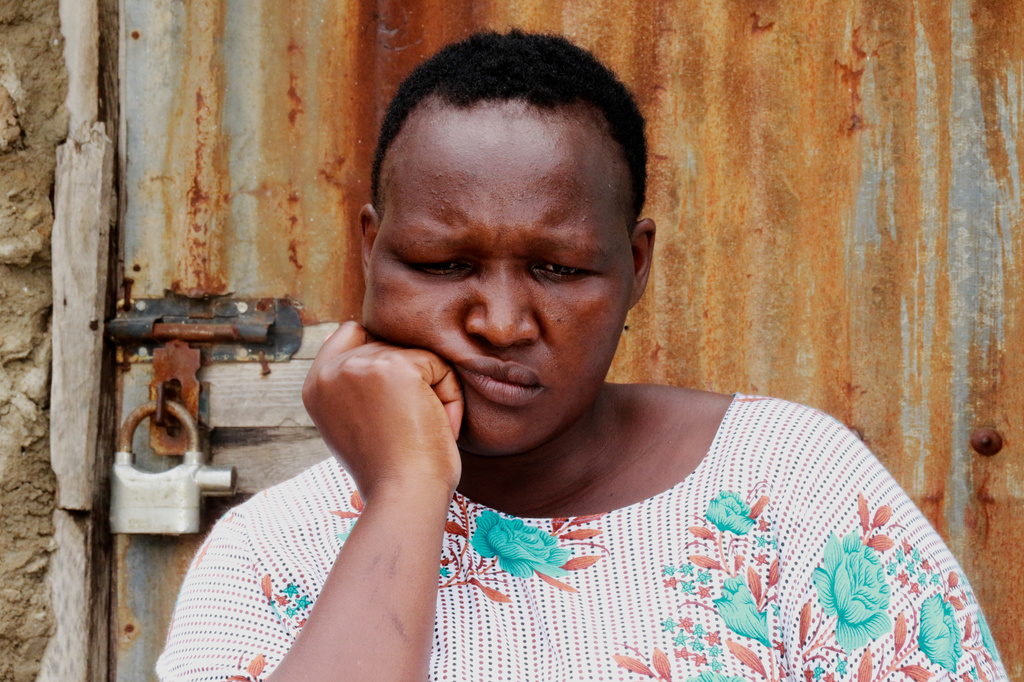 A woman sits outside her house in Owino Uhuru village in Mikindani, Mombasa County, Kenya, on April 10, 2026. (AP Photo/Kelvin Rading)