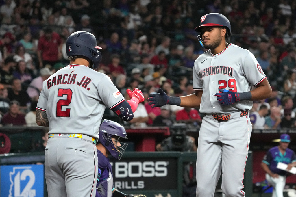 Washington Nationals' James Wood, right, celebrates with Luis García Jr. (2) after hitting a solo home run against the Arizona Diamondbacks in the third inning of a baseball game, Friday, June 5, 2026, in Phoenix. (AP Photo/Rick Scuteri)