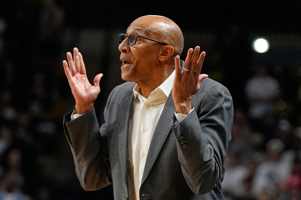 Central Florida head coach Johnny Dawkins directs his team against Kansas during the first half of an NCAA college basketball game, Saturday, Jan. 3, 2026, in Orlando, Fla. (AP Photo/John Raoux)