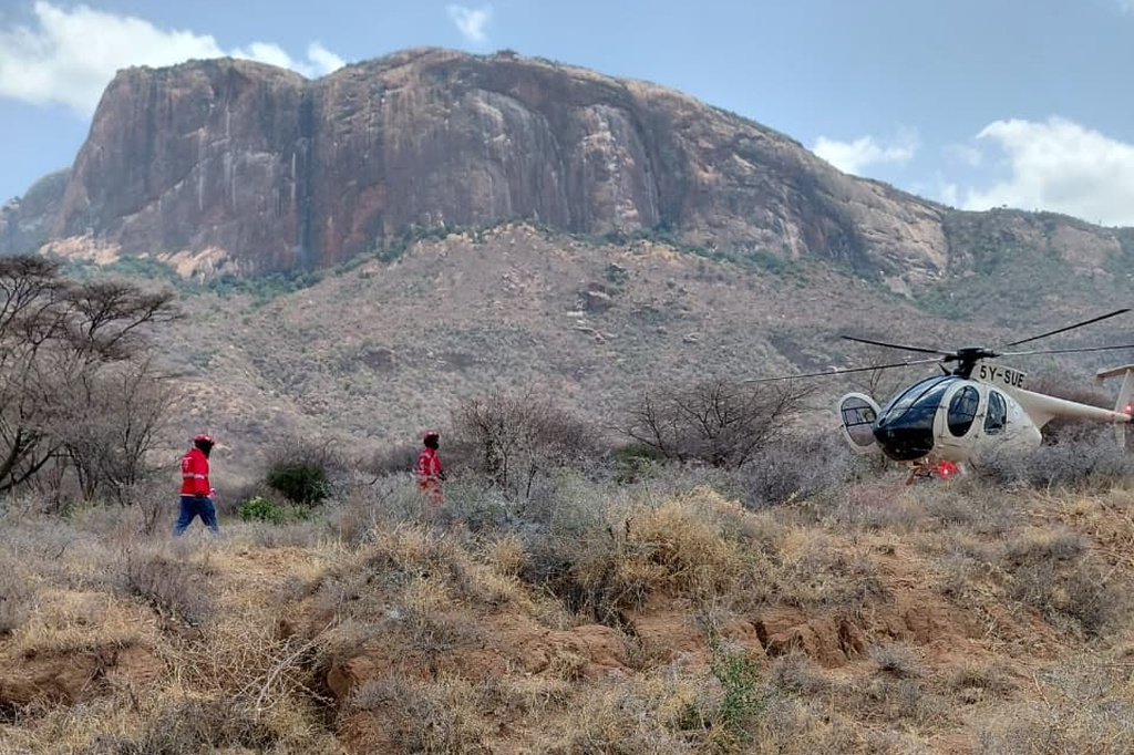 This photo provided by Kenya Red Cross shows Kenya Red Cross emergency response teams during a multi-agency rescue and recovery operation in response to a helicopter crash near Mt. Ololokwe in Samburu, Kenya, Wednesday, Aug. 19, 2026. (Kenya Red Cross via AP) ADDITION: Removes reference to killed tourists