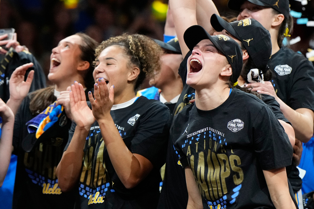 UCLA guard Gabriela Jaquez (11) celebrates with teammates after UCLA defeated South Carolina in the women's National Championship Final Four NCAA college basketball tournament game, Sunday, April 5, 2026, in Phoenix. (AP Photo/Ross D. Franklin)