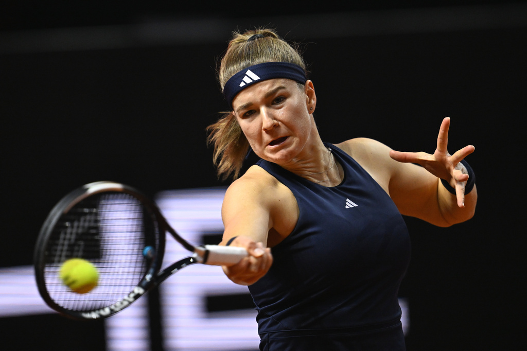 Czech Republic's Karolina Muchova returns a shot to Kazakhstan's Elena Rybakina, during the women's final match at the Stuttgart Open tennis tournament, in Stuttgart, Germany, Sunday, April 19, 2026. (Marijan Murat/dpa via AP) CORRECTION:name corrected to Elena instead of Jelena