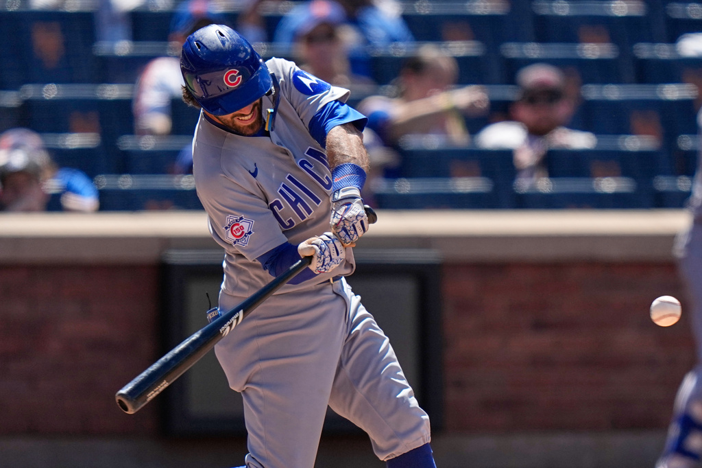 Chicago Cubs' Dansby Swanson (7) hits a grand slam during the eighth inning of a baseball game against the New York Mets Wednesday, June 24, 2026, in New York. (AP Photo/Frank Franklin II)