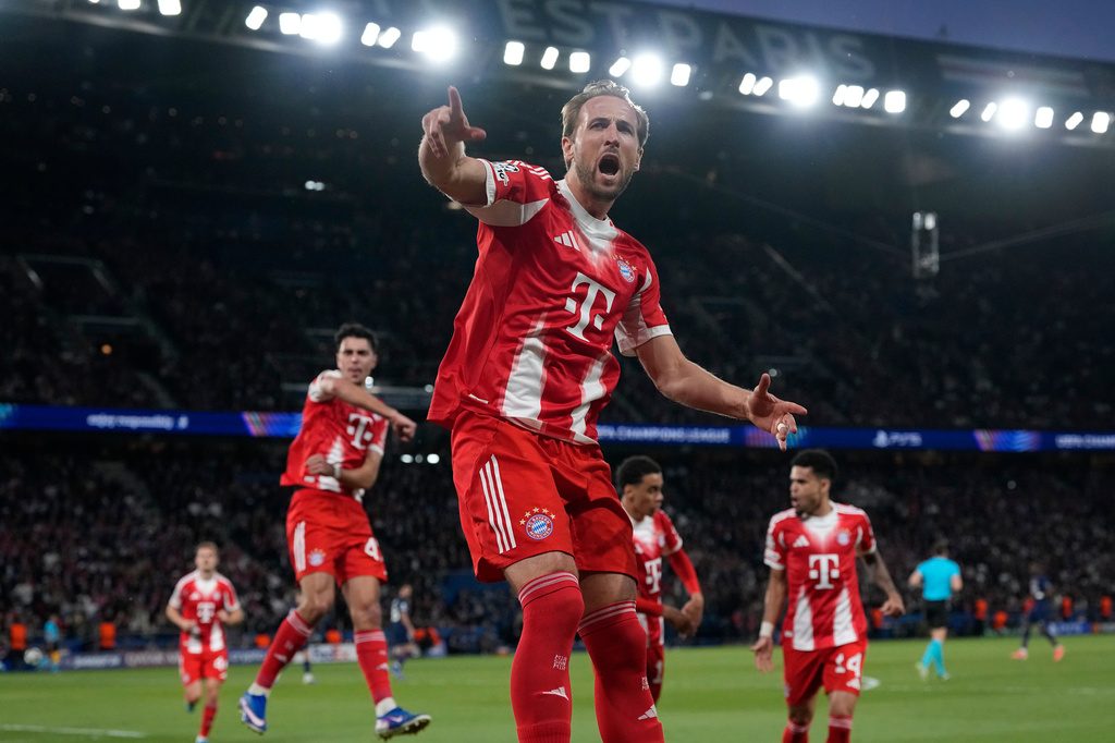 Bayern's Harry Kane celebrates after scoring a penalty, the opening goal of his team during the Champions League semifinal first leg soccer match between Paris Saint-Germain and Bayern Munich in Paris, Tuesday, April 28, 2026. (AP Photo/Christophe Ena)