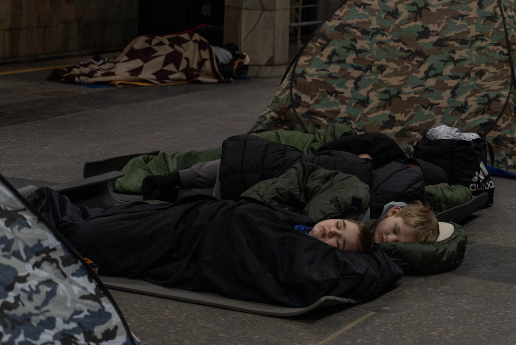 People take shelter in a metro station, being used as a bomb shelter, during a Russian drones attack in Kyiv, Ukraine, Tuesday, Feb. 3, 2026. (AP Photo/Alex Babenko)