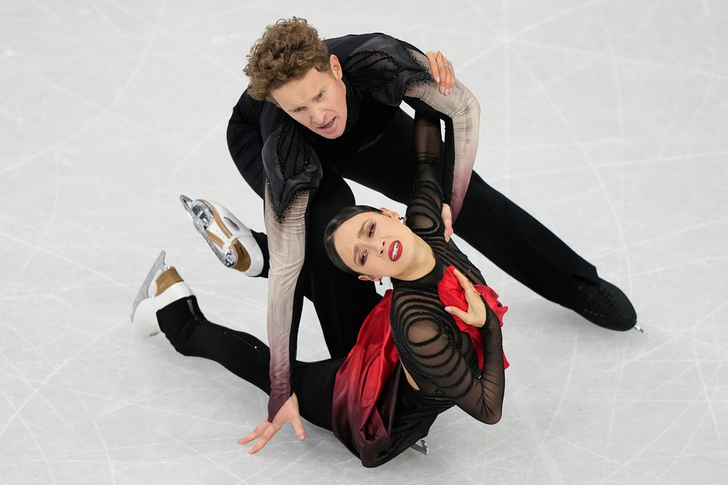Madison Chock and Evan Bates of the United States compete during the ice dancing free skate in figure skating at the 2026 Winter Olympics, in Milan, Italy, Wednesday, Feb. 11, 2026. (AP Photo/Natacha Pisarenko)