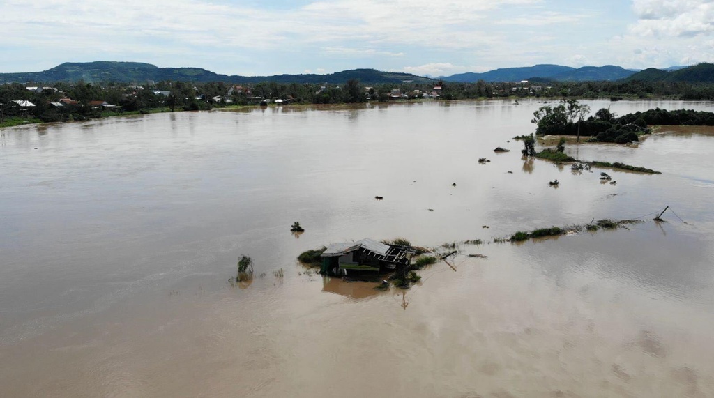 This aerial photo shows a building submerged in flooding in Dak Lak, Vietnam on Friday, Nov. 7, 2025 after Typhoon Kalmaegi lashed Vietnam with fierce winds and torrential rains. (AP Photo/Hau Dinh)