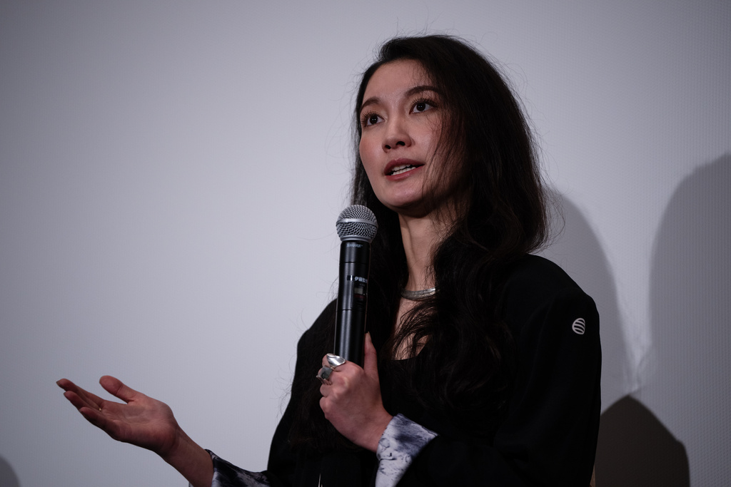 Director Shiori Itō speaks after the Japan premiere of "Black Box Diaries" at a cinema in Tokyo, Friday, Dec. 12, 2025. (AP Photo/Louise Delmotte)