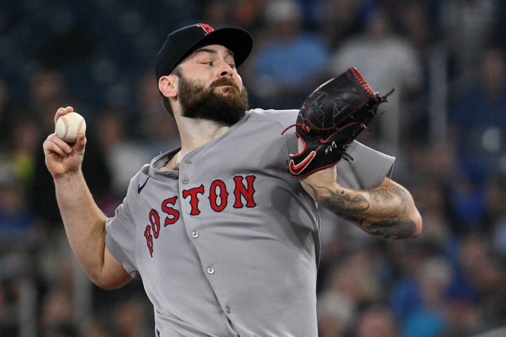 Boston Red Sox starting pitcher Lucas Giolito (54) throws to a Toronto Blue Jays batter in first inning American League baseball action in Toronto on Tuesday, Sept. 23, 2025. (Jon Blacker/The Canadian Press via AP)