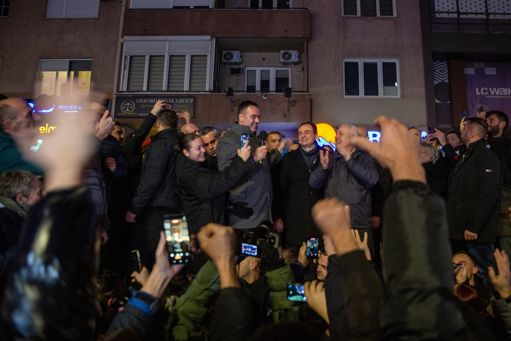 Kosovo's acting Prime Minister and leader of VeteVendosje political party Albin Kurti celebrates with his supporters in Kosovo's capital Pristina, Sunday Dec. 28, 2025. (AP Photo/Visar Kryeziu)