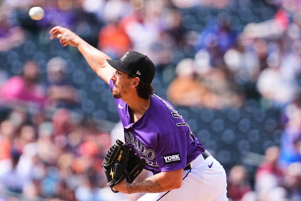 Colorado Rockies starting pitcher Michael Lorenzen works against the Houston Astros in the second inning of a baseball game Wednesday, April 8, 2026, in Denver. (AP Photo/David Zalubowski)