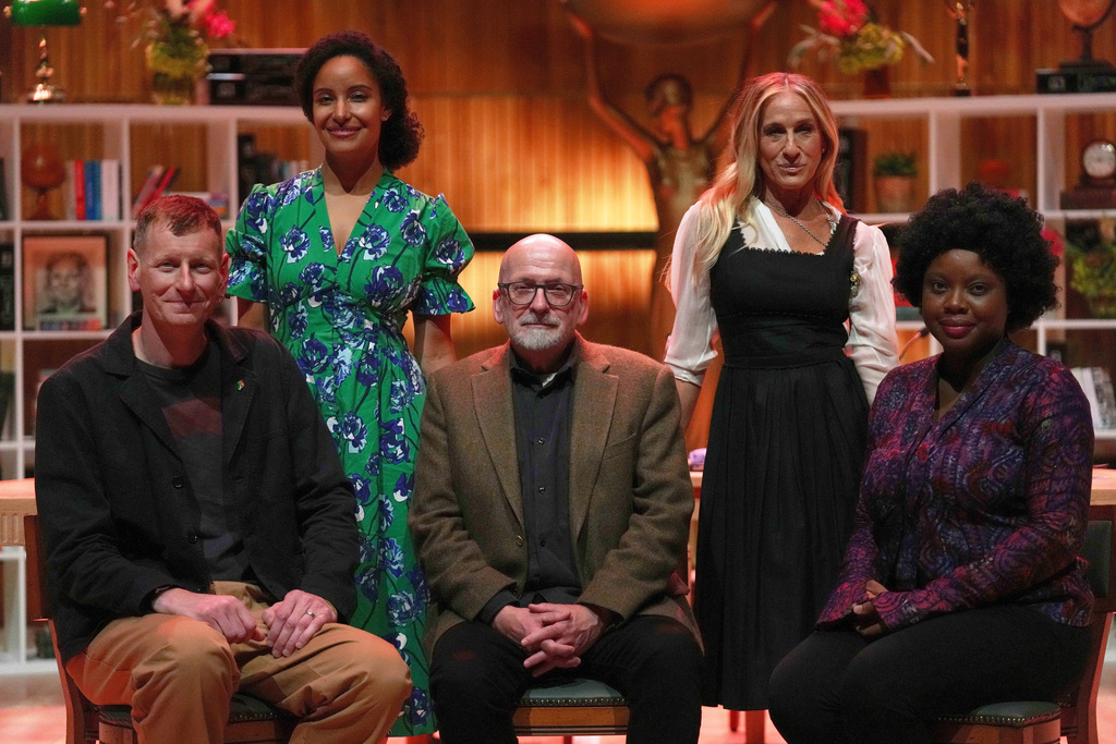 FILE - The Booker Prize 2025 judges, left to right, writer Chris Power, author Kiley Reid, 1993 Booker Prize winner Roddy Doyle, actor Sarah Jessica Parker, and Booker Prize-longlisted novelist Ayobami Adebayo, pose for a photo during the the Booker Prize 2025 shortlist announcement event, held at Southbank Centre, in London, Sept. 23, 2025. (AP Photo/Joanna Chan, File)