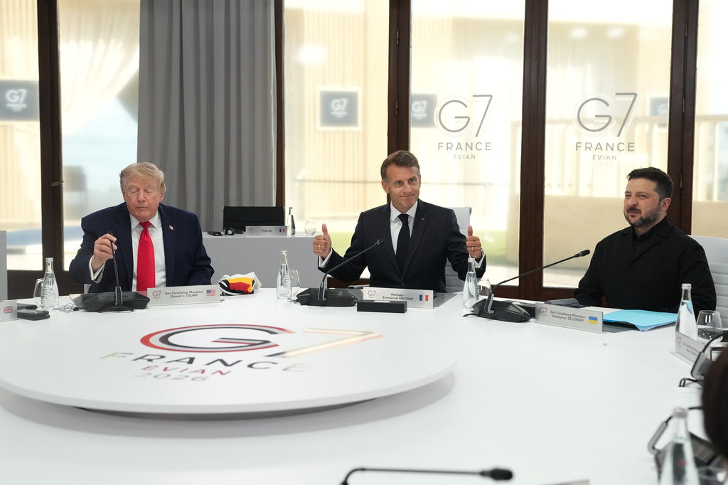From left, U.S. President Donald Trump, French President Emmanuel Macron and Ukrainian President Volodymyr Zelenskyy during a working session at the G7 summit in Evian-les-Bains, France, Tuesday, June 16, 2026. (AP Photo/Thibault Camus, Pool)