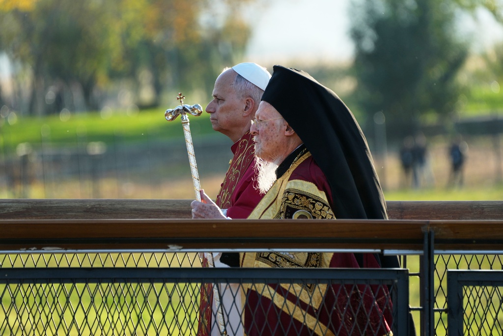 Pope Leo XIV and the Ecumenical Patriarch Bartholomew I, right, lead an Ecumenical prayer service near the archaeological excavations of the ancient Basilica of Saint Neophytos, in Iznik, Turkey, Friday, Nov. 28, 2025. (AP Photo/Domenico Stinellis)