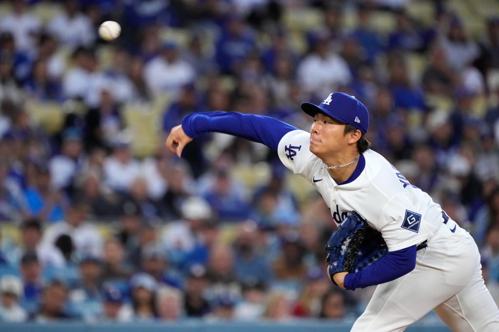 Los Angeles Dodgers starting pitcher Yoshinobu Yamamoto throws to the plate during the first inning of a baseball game against the New York Mets, Tuesday, April 14, 2026, in Los Angeles. (AP Photo/Mark J. Terrill)
