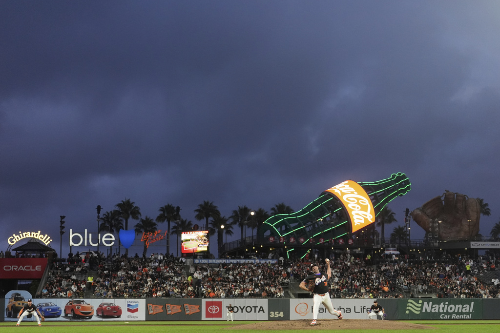 San Francisco Giants pitcher Robbie Ray throws against the Arizona Diamondbacks during the third inning of a baseball game in San Francisco, Tuesday, Sept. 9, 2025. (AP Photo/Jeff Chiu)