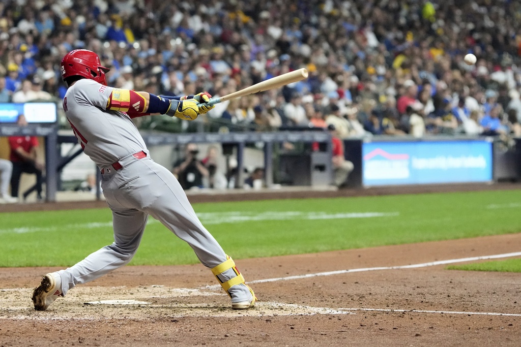St. Louis Cardinals' Lars Nootbaar hits an RBI single during the sixth inning of a baseball game against the Milwaukee Brewers Friday, Sept. 12, 2025, in Milwaukee. (AP Photo/Morry Gash)