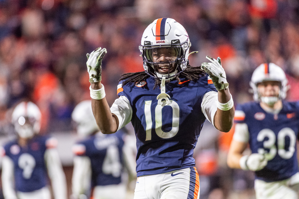 Virginia defensive back Ja'Son Prevard (10) getting the student section involved during the second half of an NCAA college football game, Saturday, Oct. 4, 2025, in Charlottesville, Va. (AP Photo/Robert Simmons)