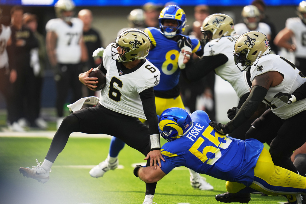 Los Angeles Rams defensive end Braden Fiske (55) sacks New Orleans Saints quarterback Tyler Shough (6) in the first half of an NFL football game Sunday, Nov. 2, 2025, in Inglewood, Calif. (AP Photo/Gregory Bull)