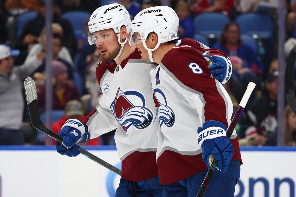 Colorado Avalanche defenseman Cale Makar (8) right, celebrates his goal with right wing Valeri Nichushkin (13) during the second period of an NHL hockey game against the Buffalo Sabres Monday, Oct. 13, 2025, in Buffalo, N.Y. (AP Photo/Jeffrey T. Barnes)