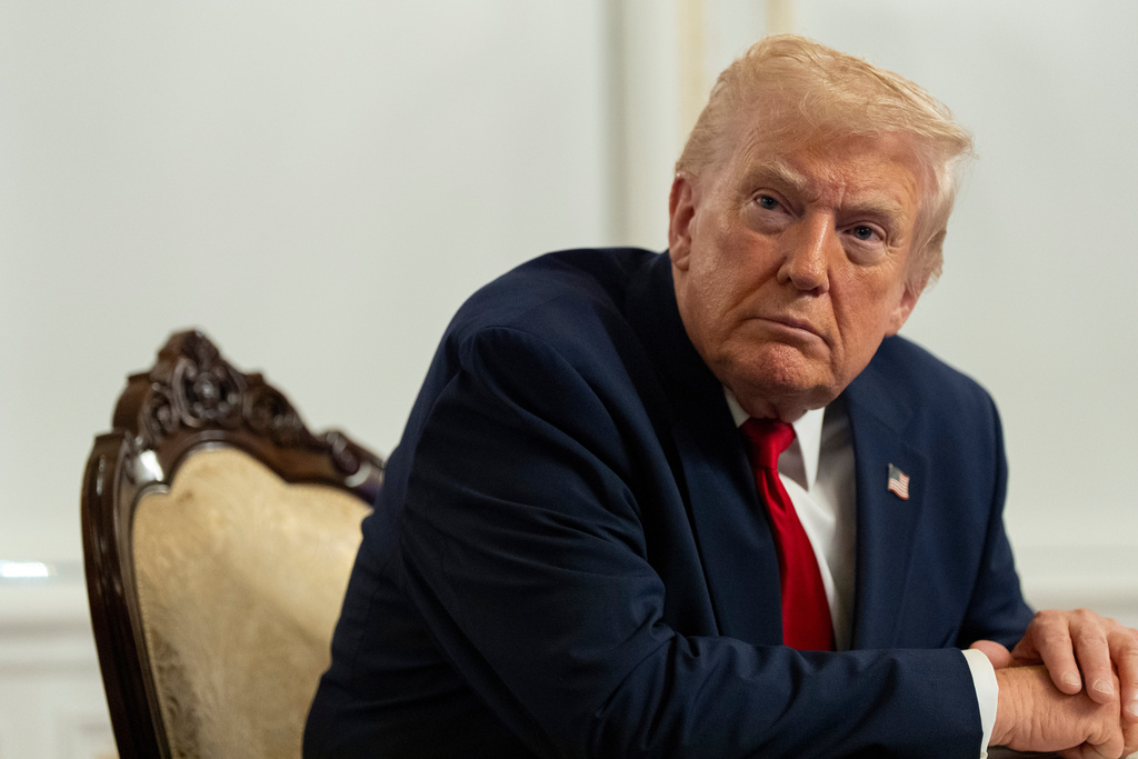 President Donald Trump speaks to reporters after speaking to troops via video from his Mar-a-Lago estate on Thanksgiving, Thursday, Nov. 27, 2025, in Palm Beach, Fla. (AP Photo/Alex Brandon)