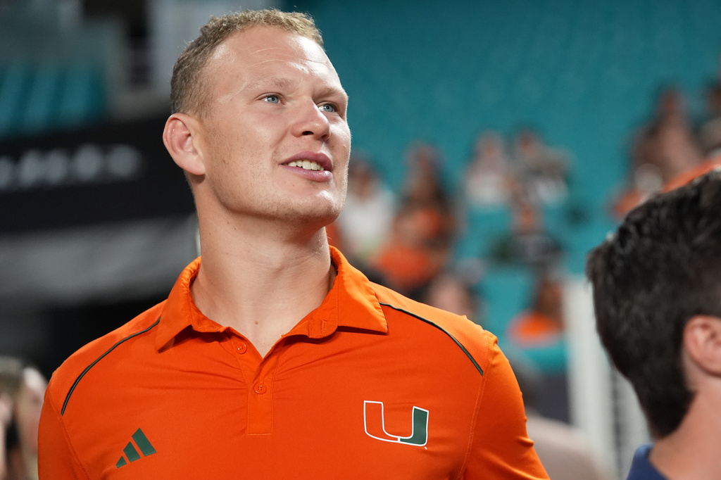 Florida Panthers forward Brady Tkachuk stands on the sideline before an NCAA college football game between Miami and Florida A&M, Thursday, Sept. 10, 2026, in Miami Gardens, Fla. (AP Photo/Lynne Sladky)