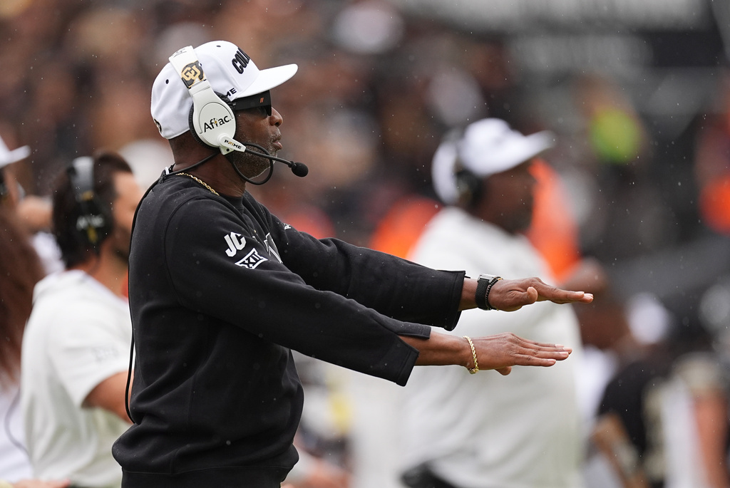 Colorado head coach Deion Sanders signals to decline a penalty against Iowa State in the first half of an NCAA college football game Saturday, Oct. 11, 2025, in Boulder, Colo. (AP Photo/David Zalubowski)