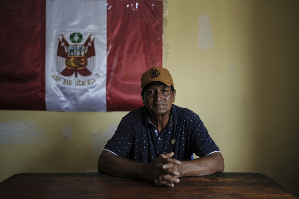 Mayor Max Ortiz poses for a portrait in his office in Santa Rosa, Peru, an island on the Amazon River at the center of a territorial dispute with Colombia, Saturday, Aug. 16, 2025. (AP Photo/Ivan Valencia)