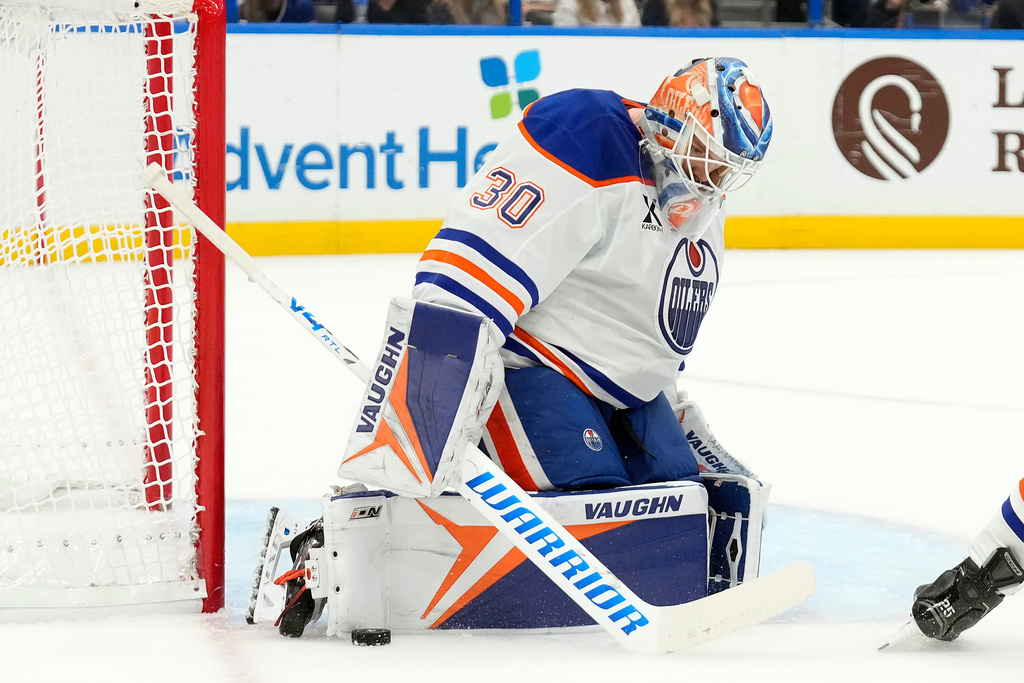 Edmonton Oilers goaltender Calvin Pickard (30) makes a pad save on a shot by the Tampa Bay Lightning during the second period of an NHL hockey game Thursday, Nov. 20, 2025, in Tampa, Fla. (AP Photo/Chris O'Meara)