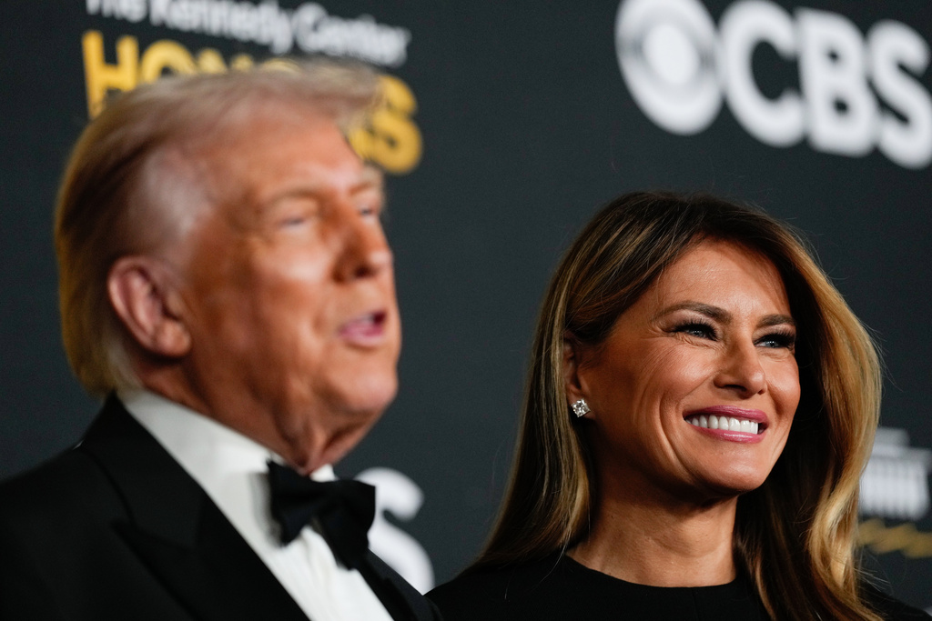 President Donald Trump and first lady Melania Trump walk the red carpet before the 48th Kennedy Center Honors, Sunday, Dec. 7, 2025, at the John F. Kennedy Center for the Performing Arts in Washington. (AP Photo/Julia Demaree Nikhinson)