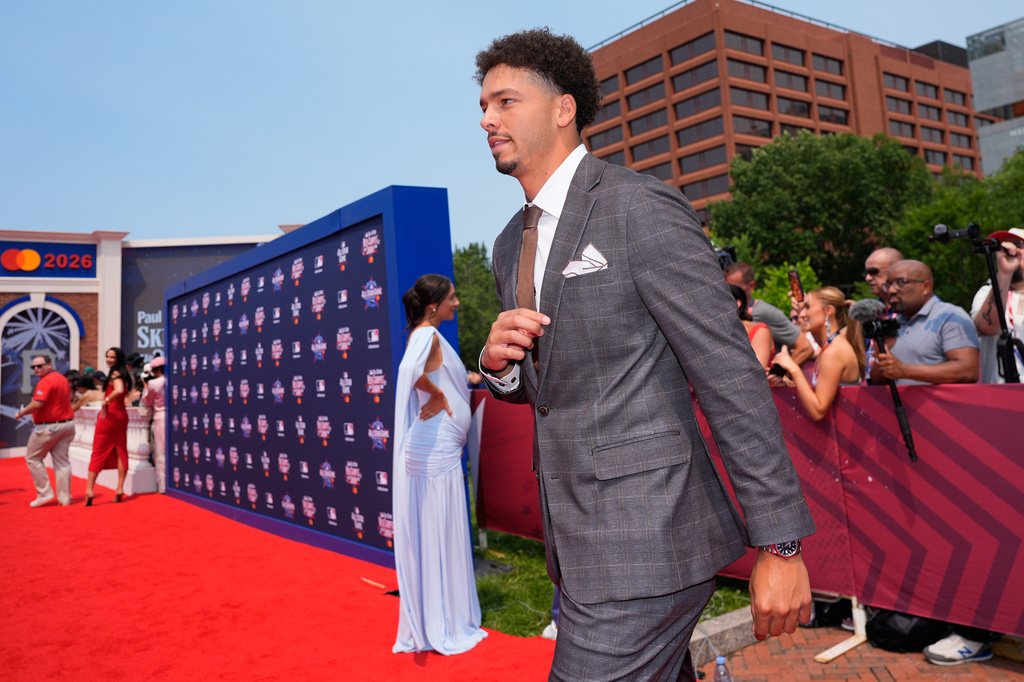 Cincinnati Reds' Chase Burns walks on the red carpet for the MLB baseball All-Star game Tuesday, July 14, 2026, in Philadelphia. (AP Photo/Chris Szagola)