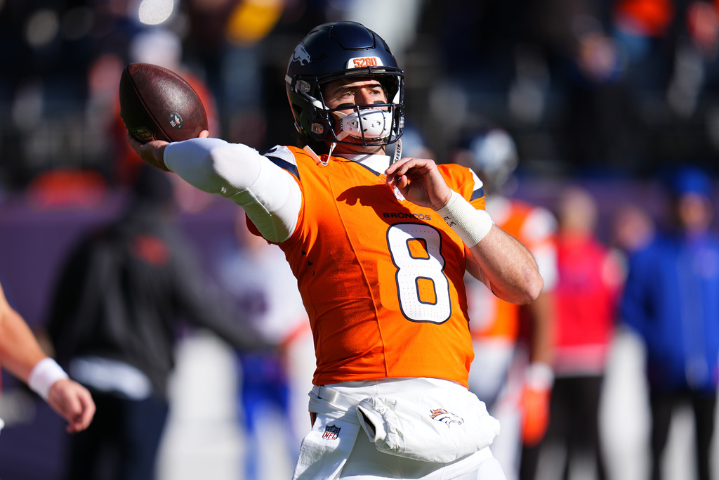 Denver Broncos quarterback Jarrett Stidham warms up before an NFL divisional round playoff football game against the Buffalo Bills, Saturday, Jan. 17, 2026, in Denver. (AP Photo/Jack Dempsey)