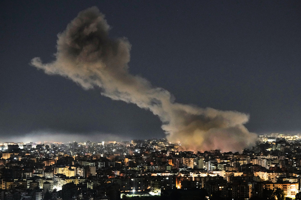 File - Smoke rises from Israeli airstrikes that struck a building housing Al-Manar channel studios in Dahiyeh, a southern suburb of Beirut, Lebanon, early on Tuesday, March 3, 2026. (AP Photo/Bilal Hussein, File)