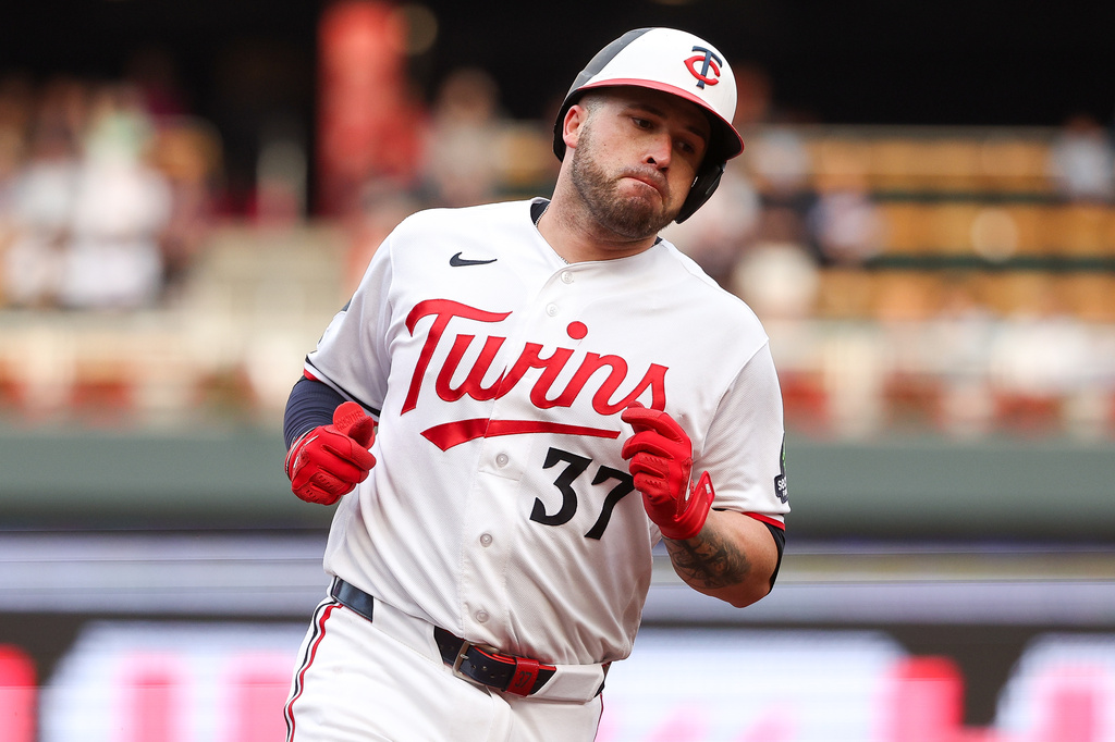 Minnesota Twins' Victor Caratini celebrates his solo home run as he runs the bases against the Los Angeles Dodgers during the second inning of a baseball game, Tuesday, June 23, 2026, in Minneapolis. (AP Photo/Matt Krohn)