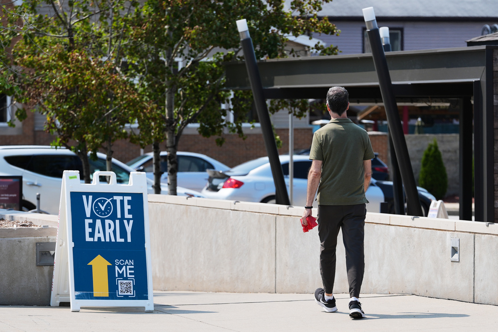 A voter arrives at a polling place in Milwaukee, Tuesday, July 28, 2026. (AP Photo/Nam Y. Huh)