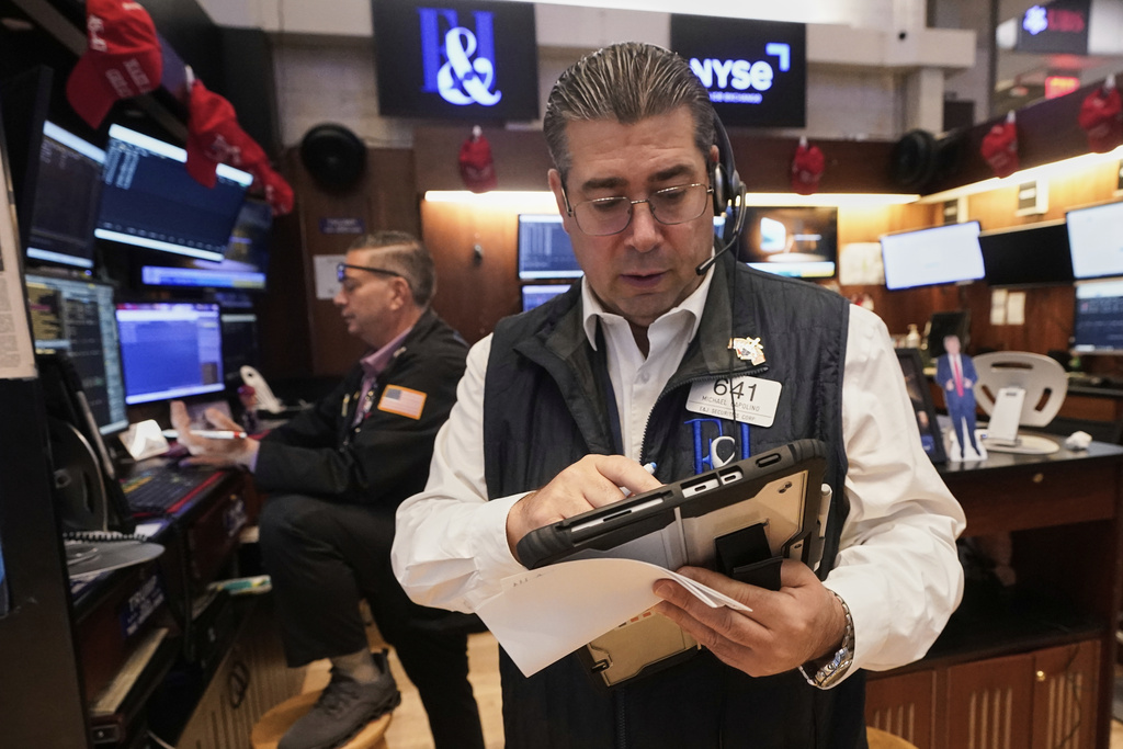 Trader Michael Capolino, right, works on the floor of the New York Stock Exchange, Wednesday, Sept. 17, 2025. (AP Photo/Richard Drew)