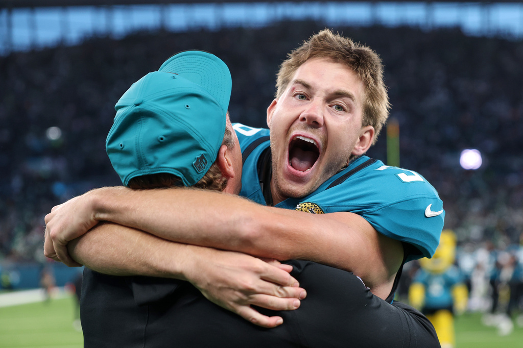Jacksonville Jaguars place kicker Cam Little (39) celebrates after scoring the winning field goal during an NFL football game against Philadelphia Eagles in London, Sunday, Oct. 11, 2026. (AP Photo/Ian Walton)