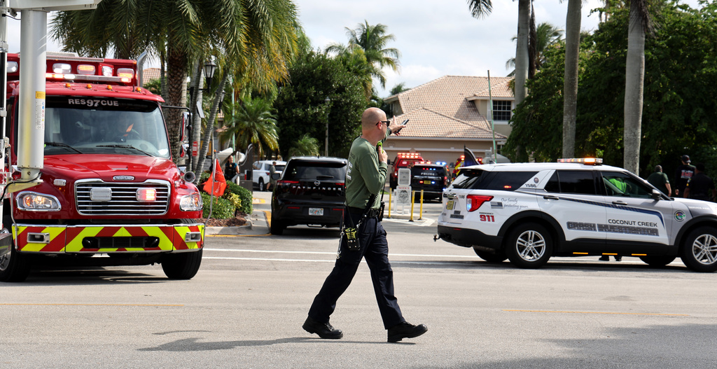 Emergency personnel from Coral Springs and Coconut Creek are on scene where a plane crashed in the Windsor Bay community in Coral Springs on Monday, Nov. 10, 2025. (Carline Jean/South Florida Sun-Sentinel via AP)