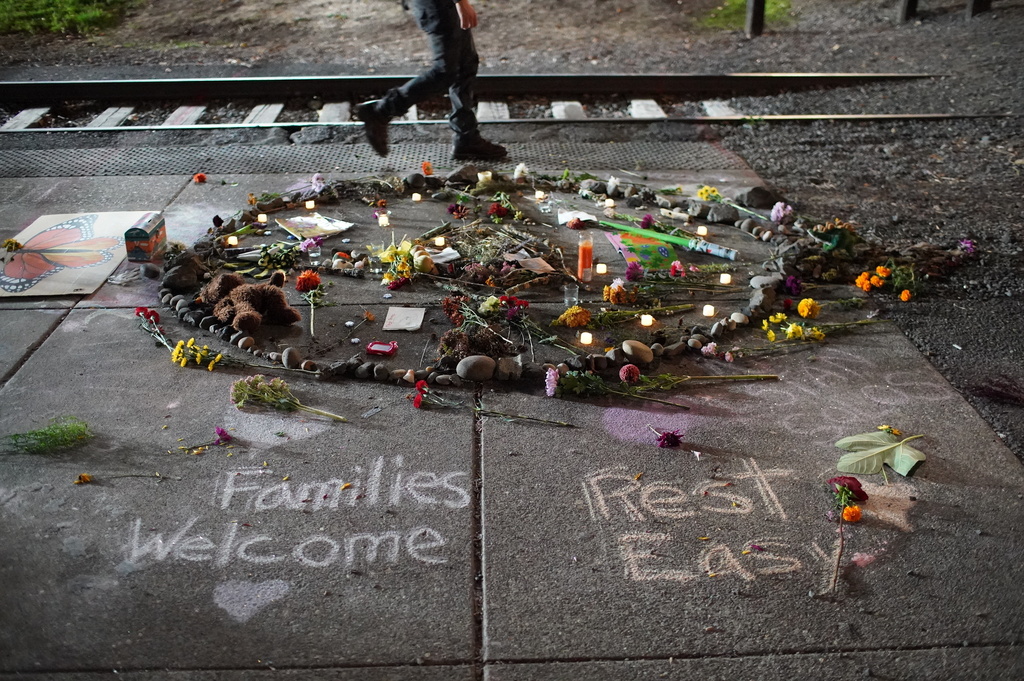 Outside the Portland ICE facility messages and items are left as people protest immigration detention, Saturday, Sept. 27, 2025, in Portland, Ore. (Samantha Swindler/The Oregonian via AP)