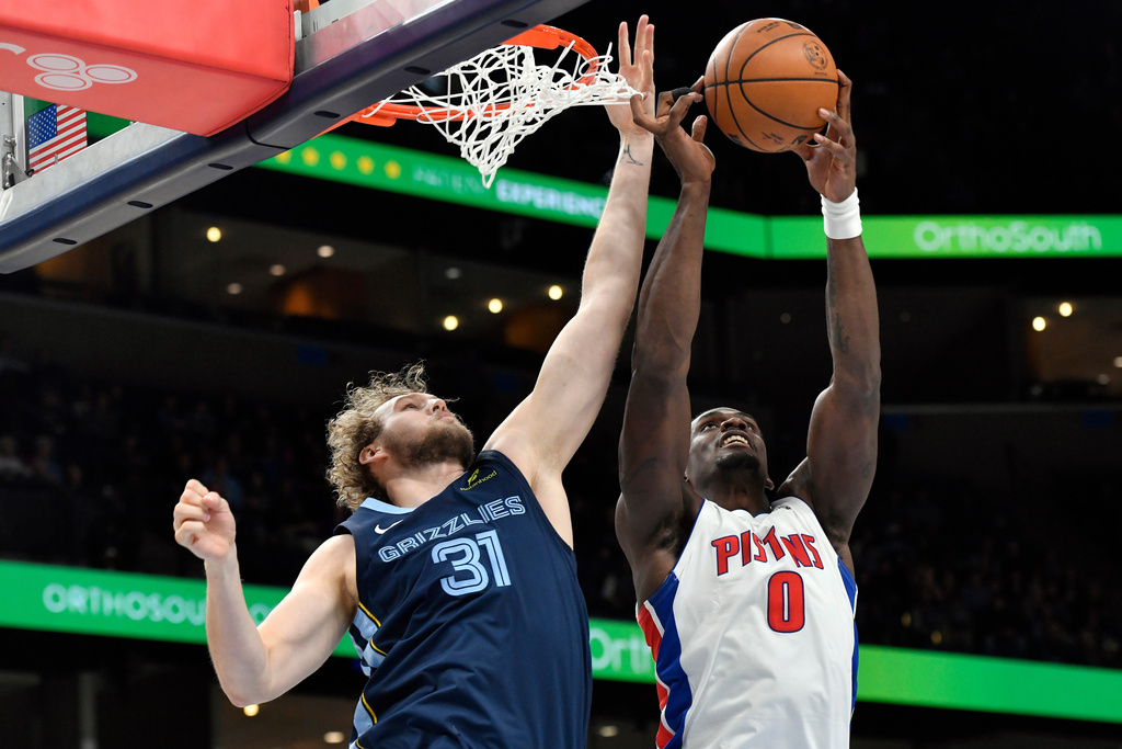 Memphis Grizzlies center Jock Landale (31) and Detroit Pistons center Jalen Duren (0) reach for a rebound in the first half of an NBA Cup basketball game Monday, Nov. 3, 2025, in Memphis, Tenn. (AP Photo/Brandon Dill)