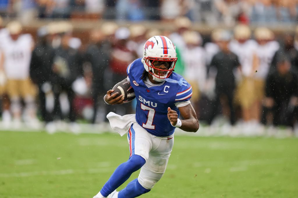 SMU quarterback Kevin Jennings rushes for a touchdown during an NCAA college football game against Boston College, Saturday, Oct. 3, 2026, in Dallas. (AP Photo/Gareth Patterson)