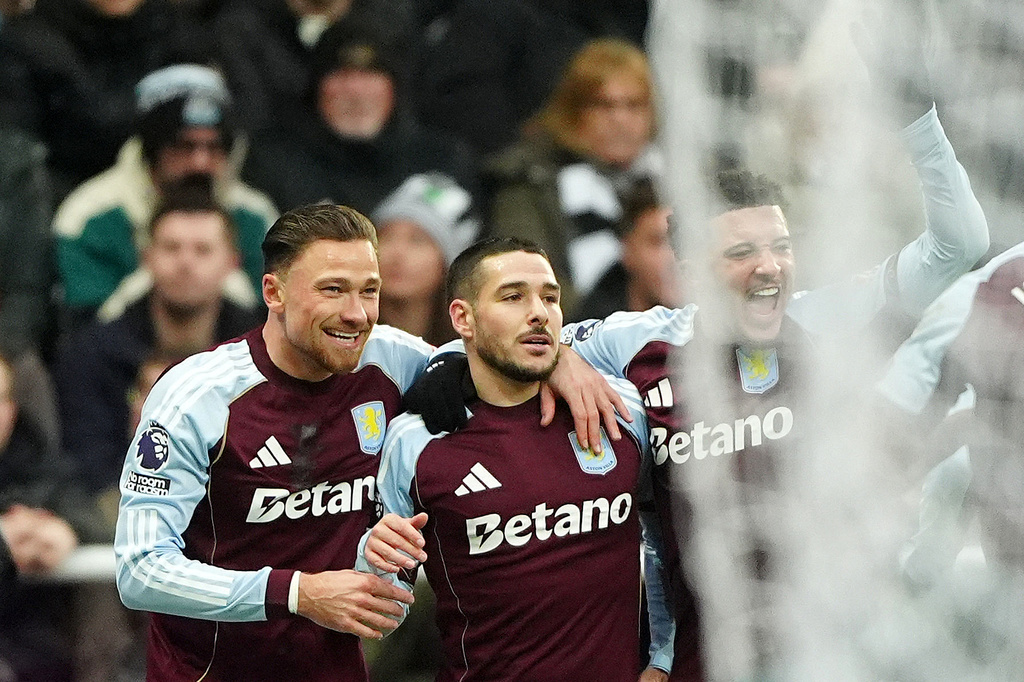 Aston Villa's Emi Buendia, center, celebrates with teammates after scoring their side's first goal during their English Premier League soccer match against Newcastle United in Newcastle upon Tyne, England, Sunday, Jan. 25, 2026. (Owen Humphreys/PA via AP)