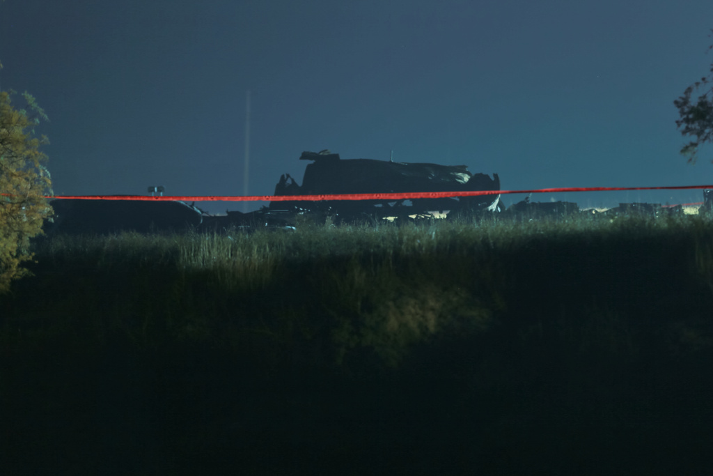 Debris is seen at a crash site of a Turkish military cargo plane in Georgia's Sighnaghi municipality, close to the Azerbaijani border on Wednesday, Nov. 12, 2025. (AP Photo/Zurab Tsertsvadze)