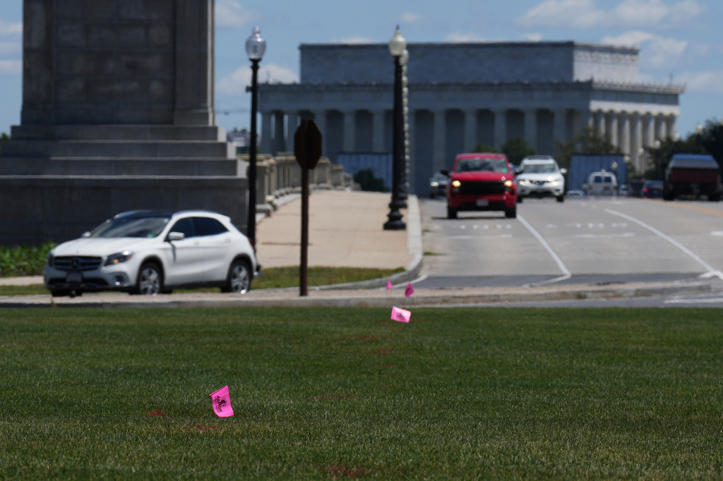 Flags placed by workers are pictured in the Memorial Circle, where President Donald Trump has proposed building an arch to commemorate the United States' 250th anniversary, Friday, May 15, 2026, in Washington. (AP Photo/Jacquelyn Martin)