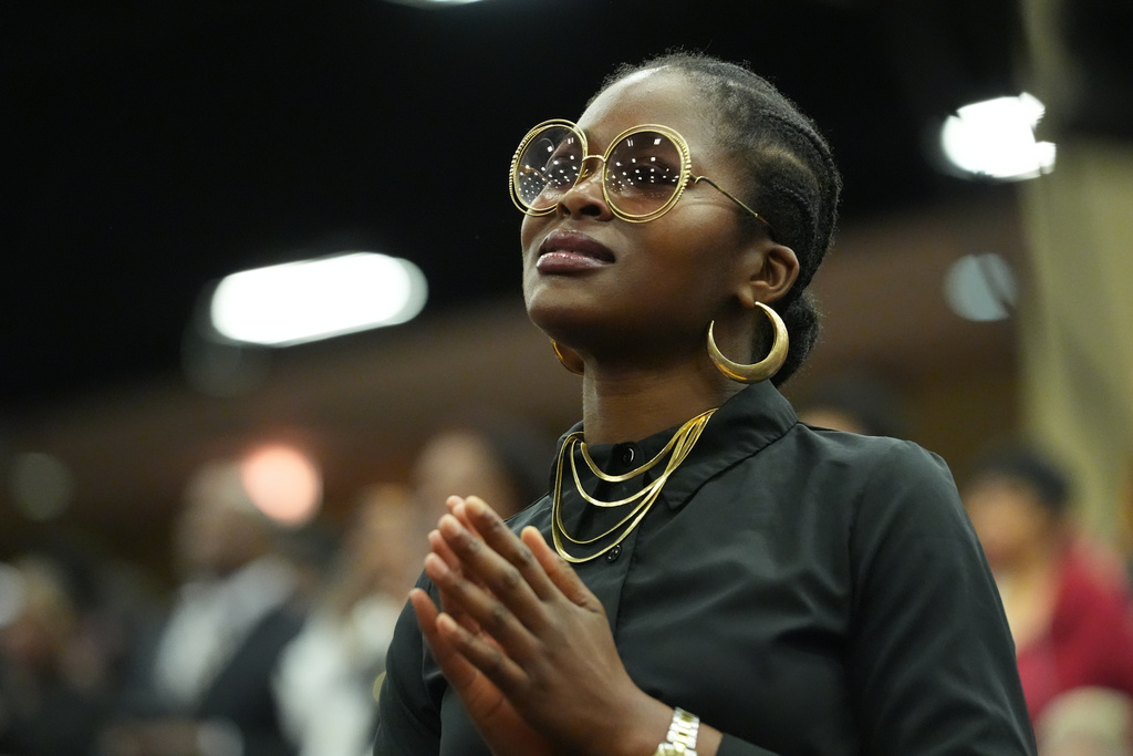 A woman stands before the Public Homegoing Service for the Rev. Jesse Jackson at the House of Hope in Chicago, Friday, March 6, 2026. (AP Photo/Nam Y. Huh)