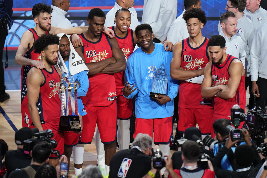 USA Stars pose for photos after a win over USA Stripes in the NBA All-Star basketball game Sunday, Feb. 15, 2026, in Inglewood, Calif. (AP Photo/Jae C. Hong)