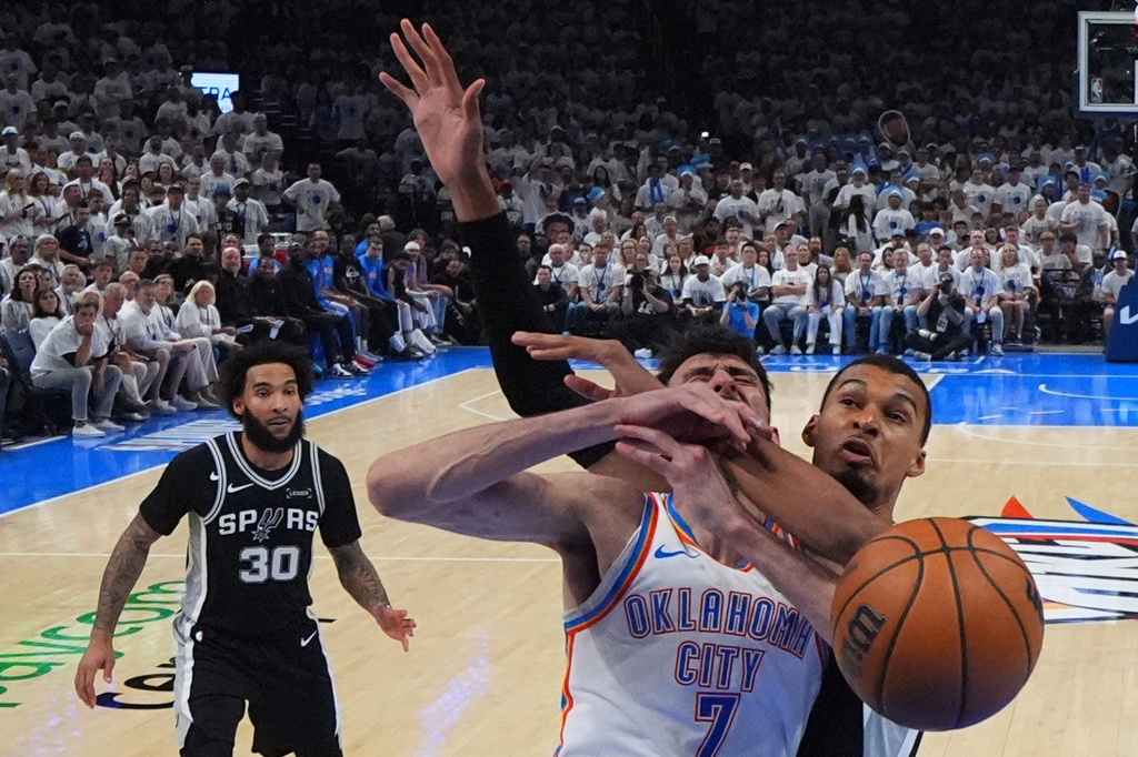 Oklahoma City Thunder center Chet Holmgren (7) shoots against San Antonio Spurs forward Victor Wembanyama (1) in the second half of Game 5 in the Western Conference finals NBA basketball playoffs series, Tuesday, May 26, 2026, in Oklahoma City. (AP Photo/Julio Cortez)
